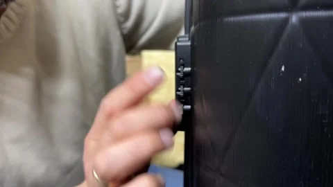 Hand setting combination lock code on suitcase close up, travel security and 스톡 동영상 337121758