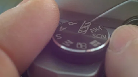 Hand setting up a digital camera. Stock Footage 103351940