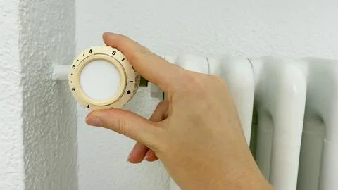 Hand Setting Heating Thermostat Temperature, Home Climate Control System Stock Photos