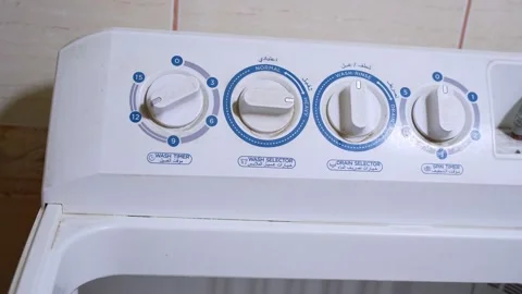 Hand Setting Wash Timer On Twin Tub Machine Stock Footage 323177214