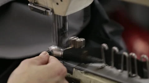 Hand sewing on a machine Stock-Footage 64539404