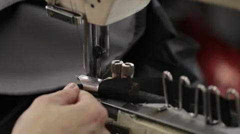 Hand sewing on a machine Stock Footage 66274705
