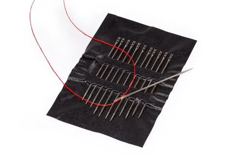 Hand sewing needle with inserted thread on set same needles Stockfoto's