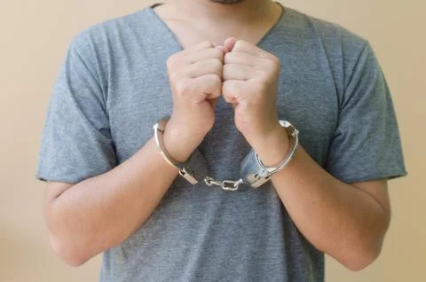 Hand in shackle Stock Photos