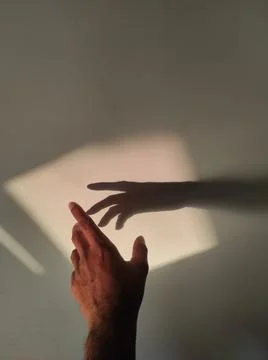 Hand with shadow Stock Photos