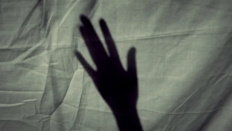 Hand shadow waving  against cloth Video stock 119074945