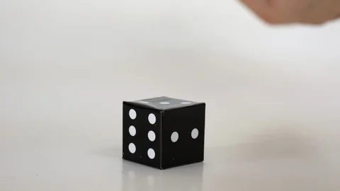 Hand shaking and roll the dice, black and white dices, cubes, game, Vidéo 122744148