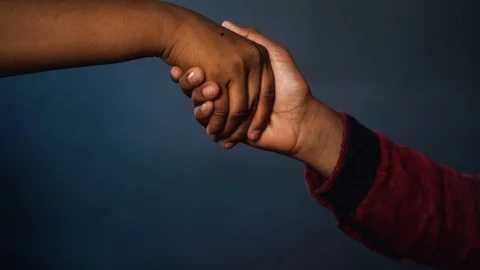 Hand shaking with black background Stock Footage 129666641