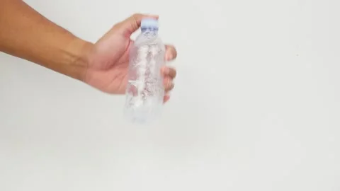 Hand Shaking a Water Bottle Stock Footage 327851722