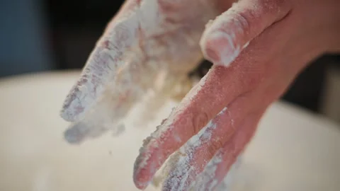 Hand-shaped dough falls gently 스톡 동영상 336047393