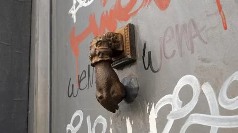 Hand shaped latch on a door Stock Photos