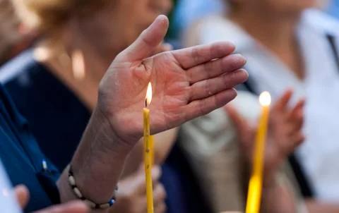 Hand shields candle Stock Photos