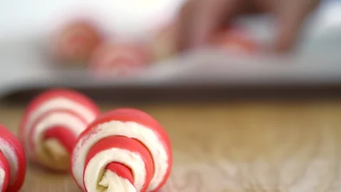 Hand shift the croissants on a baking tray Stock Footage 89388142
