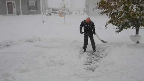 Hand-shoveling Snow Stock Footage 70263358