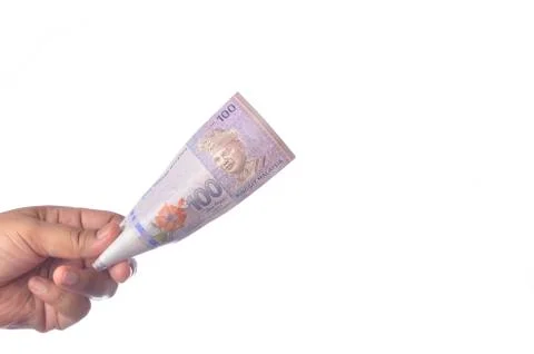 Hand showing 100 Ringgit Malaysia (MYR) money with over white  background and Stock Photos