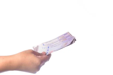 Hand showing 100 Ringgit Malaysia (MYR) money with over white  background and Stock Photos