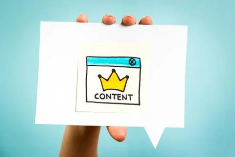 Hand showing a content message with crown. Content marketing concept. 写真素材