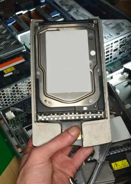 Hand showing hard disk Stock Photos
