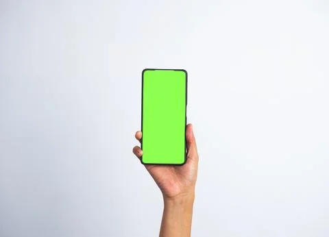 Hand showing smartphone with blank screen isolated on white background. Bus.. Stock Photos