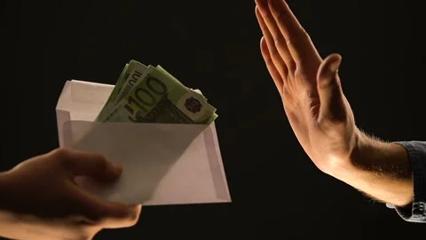 Hand showing stop gesture to envelope with euros, refusing corrupt money, bribe Stock Footage 105049673
