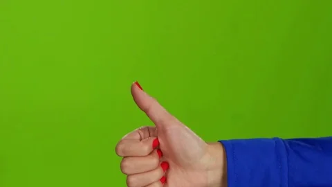 Hand showing thumbs up on green screen background. Sign language Stock Footage