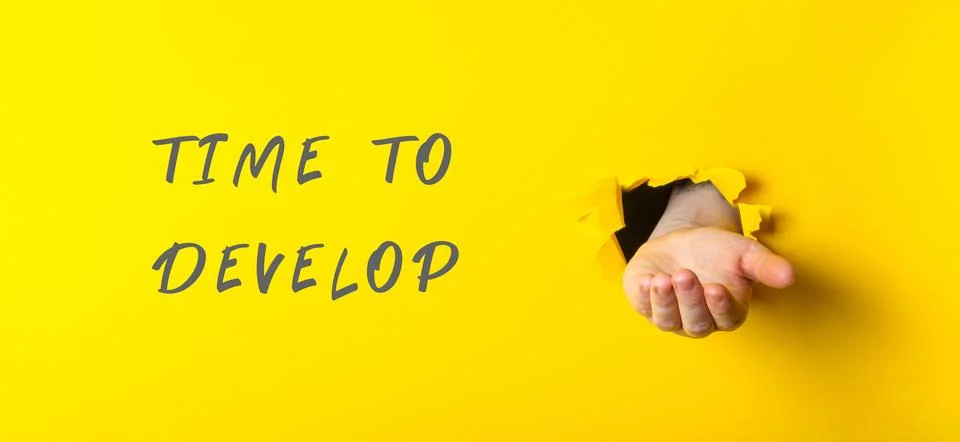 Hand is shown with the words Time to Develop written below it Fotos de archivo