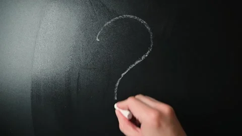 A hand is shown writing a question mark on a chalkboard. This activity takes Stockbeeldmateriaal 338186410