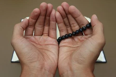 The hand that shows the gesture of praying Stock Photos