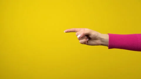 The hand shows the index finger to the empty space. Studio shooting on an Stock Footage 143643548