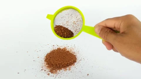 Hand sifting chili powder Stock Footage 288594136