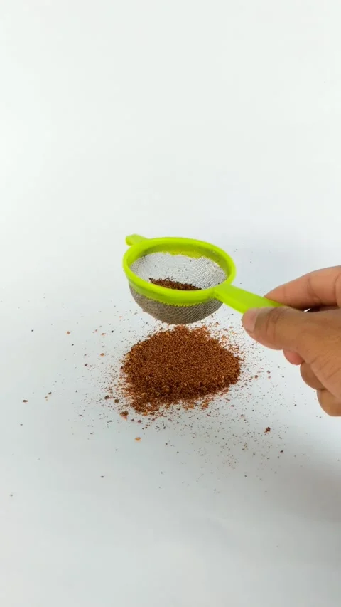 Hand sifting chili powder Stock Footage 288594166