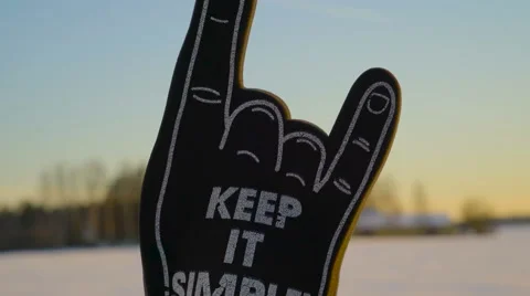 A hand sign with keep it simple phrase Stock Footage 61305814