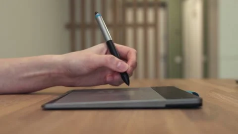 Hand signing digital document using stylus and digital tablet on wooden office 스톡 동영상 232044875