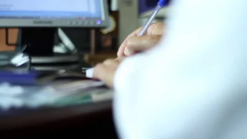 Hand signing document Stock Footage 77046676