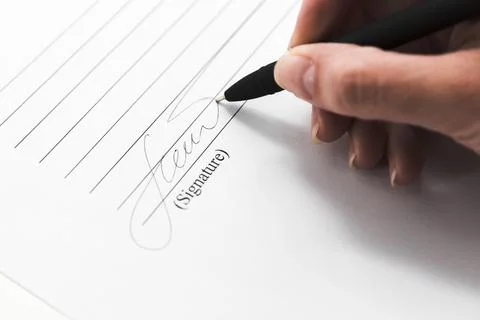Hand signing document with pen. High quality photo Stock Photos