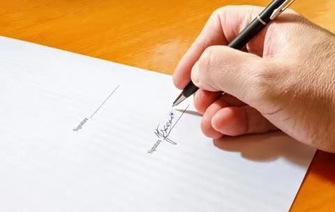 Hand signing document Foto stock