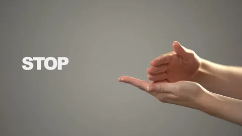 Hand signing stop in asl, text on background communication for deaf, tutorial Stock Footage 105079290