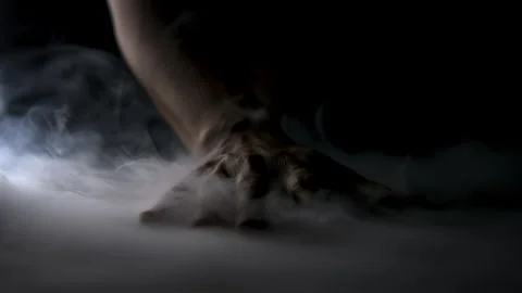 A Hand Sits on a Table Surrounded by Wisps of Smoke Stock Footage 270393112