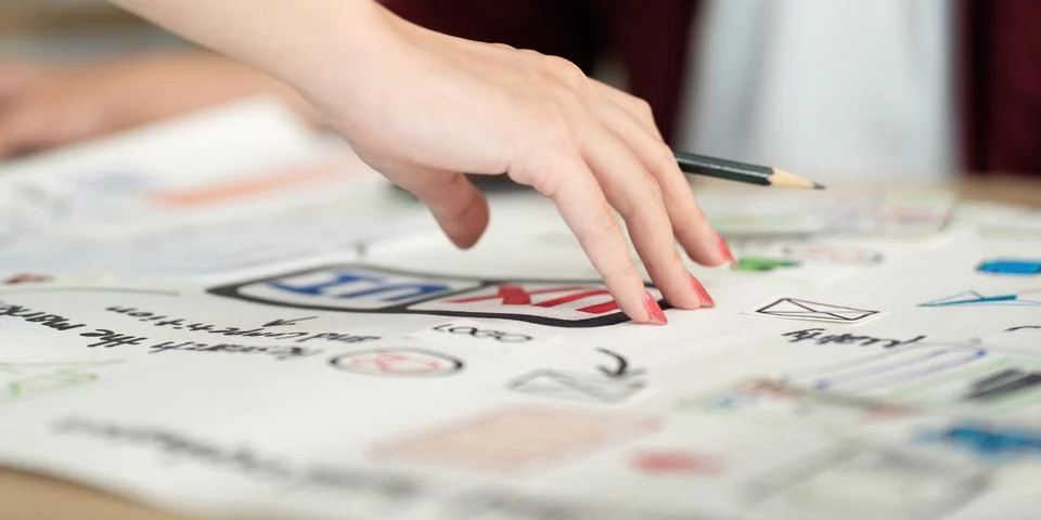 Hand Sketching User Interface Elements on Paper Stock Photos