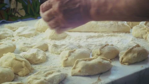 The hand skillfully shapes the dough Stock Footage 313270397