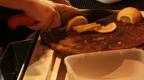 Hand slice a lemon Stock Footage 39951996