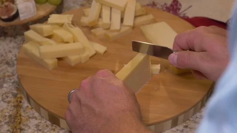 Hand Slicing Parmesan Cheese On Cutting Board In Slow Motion Stock Footage 83360347