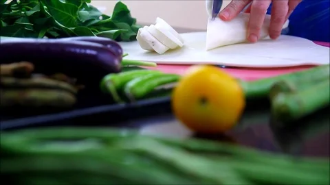 Hand slicing radish or labanos on a Stock Video Pond5