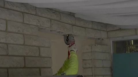 Hand slicing through block concrete Stock Footage 293007603