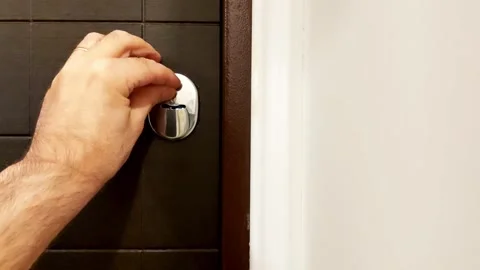 Hand Slides Door Lock Shutter for Smooth Security Access Stock-Footage 317806260