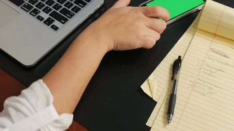 Hand slides green-screen smart phone close Video stock 118636177