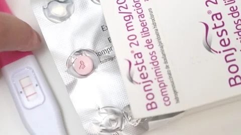 Hand Sliding Pregnancy Test Out of Frame Leaving Prenatal Medications Stock Footage 340428214