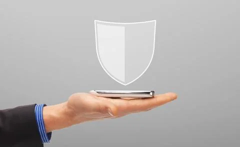 Hand with smartphone and antivirus program icon Stock Photos