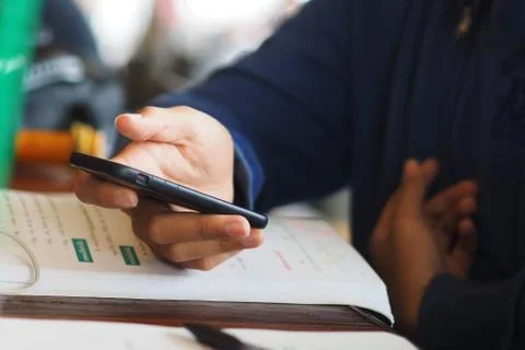 Hand with smartphone Stock Photos