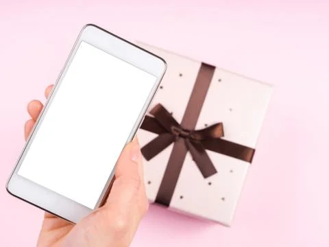 Hand with smartphone screen on pink Stock Photos